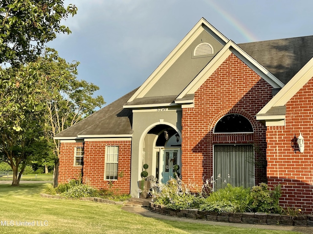 5269 Blocker St, Olive Branch, MS 38654 - traditional-style home featuring brick siding, roof with shingles, and a front lawn