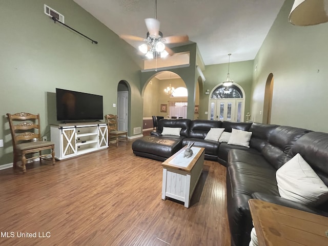 5269 Blocker St, Olive Branch, MS 38654 - living area with arched walkways, a ceiling fan, high vaulted ceiling, and wood finished floors