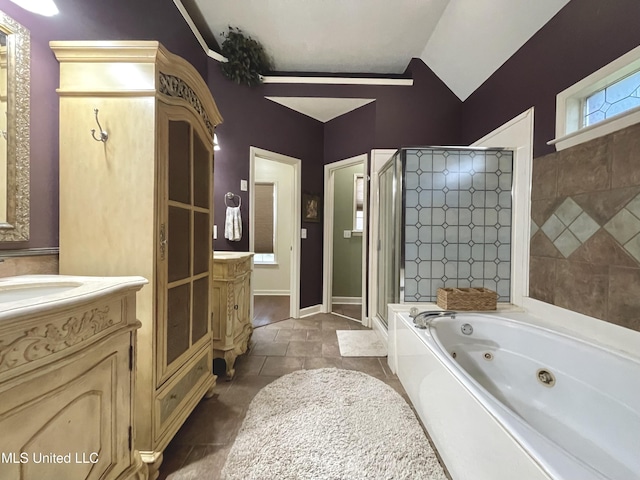 5269 Blocker St, Olive Branch, MS 38654 - full bathroom with a stall shower, vanity, a whirlpool tub, and lofted ceiling