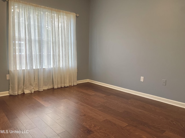5269 Blocker St, Olive Branch, MS 38654 - spare room with dark wood finished floors and baseboards