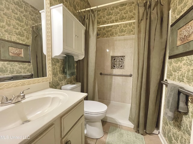5269 Blocker St, Olive Branch, MS 38654 - full bath featuring wallpapered walls, vanity, tiled shower, and tile patterned flooring