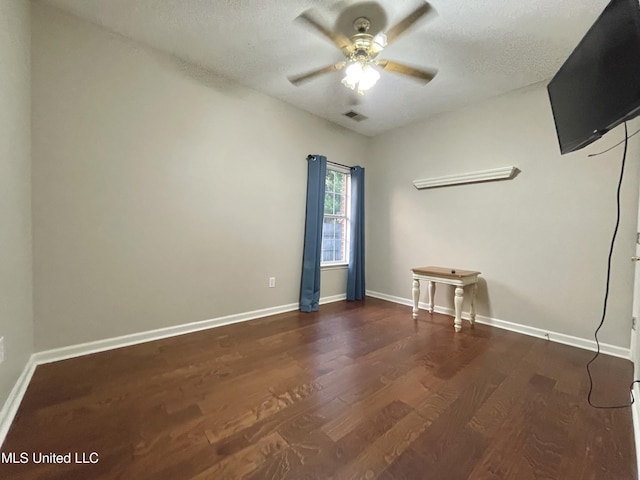 5269 Blocker St, Olive Branch, MS 38654 - empty room with a ceiling fan, wood finished floors, and a textured ceiling