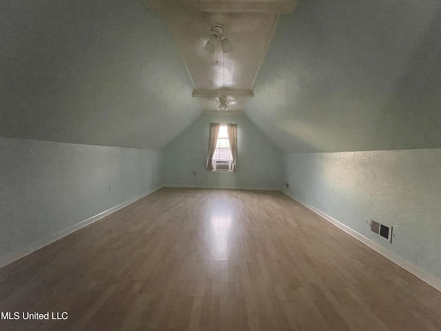 5269 Blocker St, Olive Branch, MS 38654 - additional living space with wood finished floors, vaulted ceiling, and cooling unit