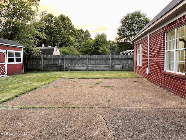 5269 Blocker St, Olive Branch, MS 38654 - fenced backyard featuring a storage shed and a patio