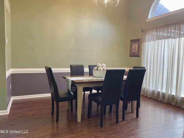 5269 Blocker St, Olive Branch, MS 38654 - dining area featuring a chandelier, dark wood-type flooring, and a high ceiling