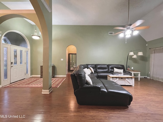 5269 Blocker St, Olive Branch, MS 38654 - living area featuring ceiling fan, wood finished floors, arched walkways, and vaulted ceiling
