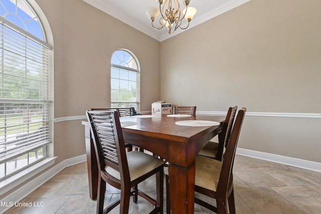 dining room featuring crown molding, a wealth of natural light, and an inviting chandelier