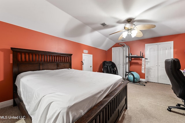 bedroom with vaulted ceiling, light colored carpet, and ceiling fan