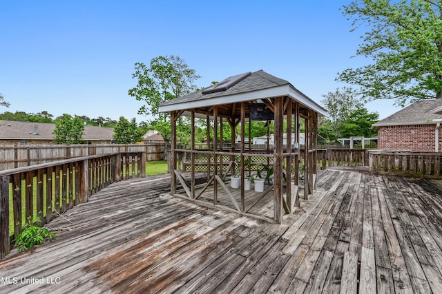 wooden deck featuring a gazebo