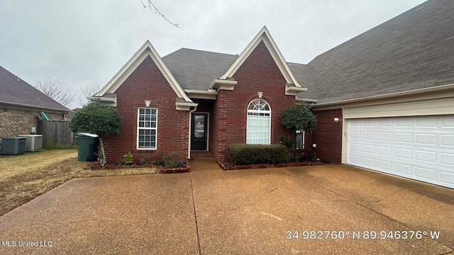 view of property featuring central AC and a garage