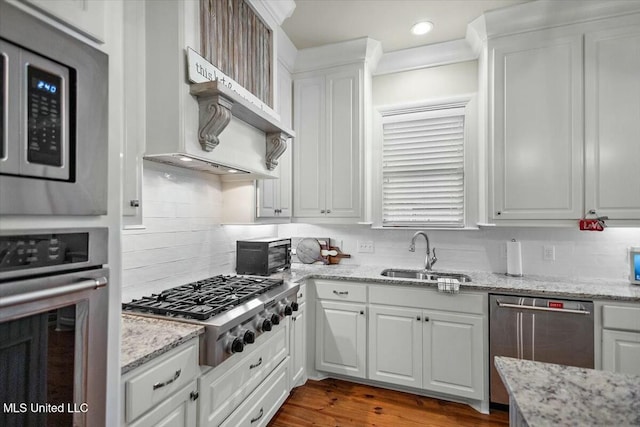 kitchen with white cabinets, sink, and stainless steel appliances