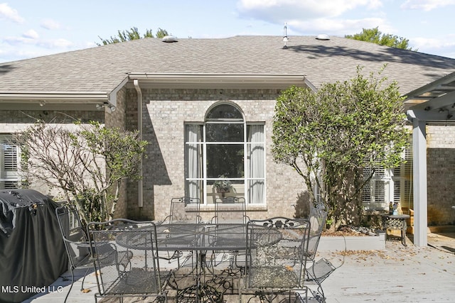 view of patio / terrace with outdoor dining space and a grill