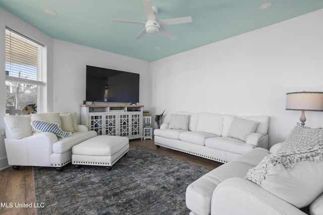 living area featuring wood finished floors and a ceiling fan