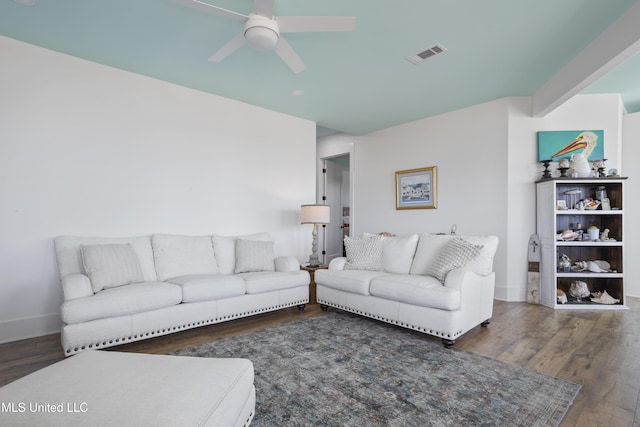 living room with a ceiling fan, wood finished floors, visible vents, and baseboards