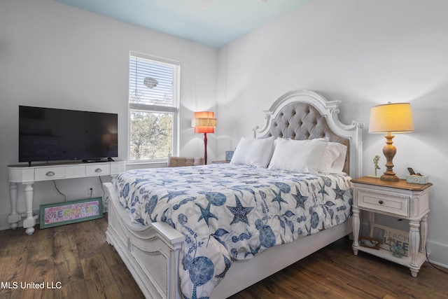 bedroom featuring wood finished floors