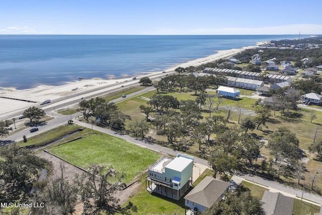 bird's eye view featuring a view of the beach and a water view