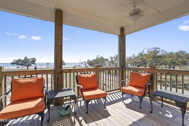 wooden deck featuring a ceiling fan