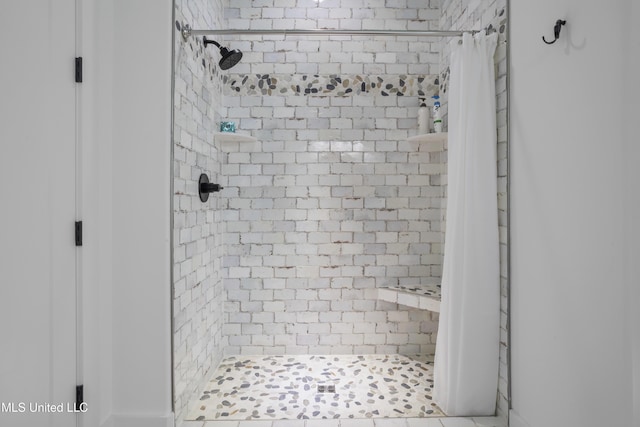 full bath with a shower stall