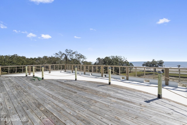 wooden terrace with a water view