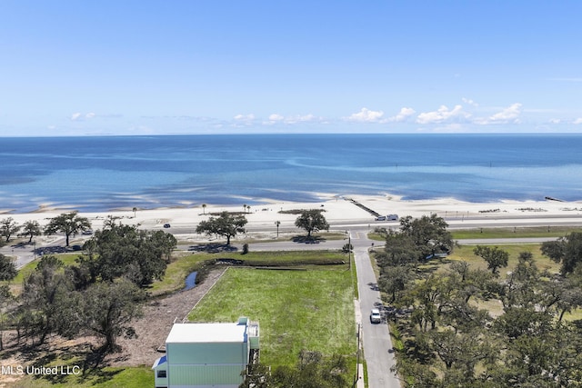 bird's eye view featuring a water view and a beach view