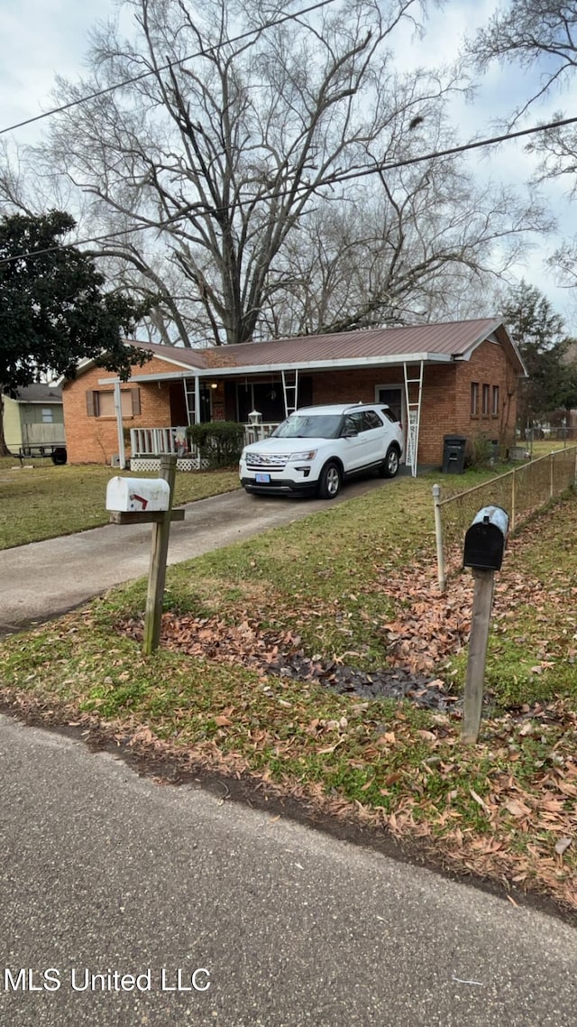 view of front facade with a carport