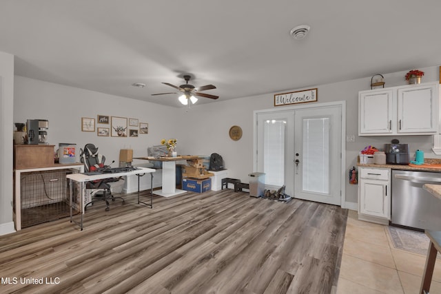 office space featuring light hardwood / wood-style floors, french doors, and ceiling fan