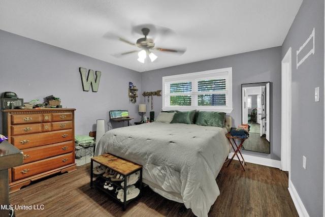 bedroom featuring dark wood-type flooring and ceiling fan