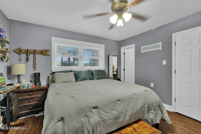 bedroom with dark wood-type flooring and ceiling fan