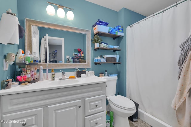 bathroom with vanity, toilet, and a shower with shower curtain