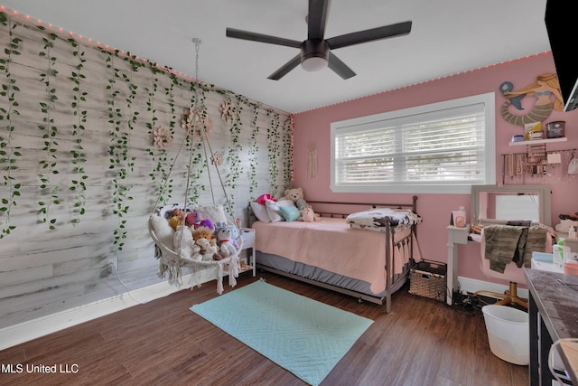 bedroom with dark wood-type flooring and ceiling fan