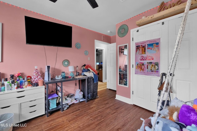 bedroom with dark wood-type flooring and ceiling fan