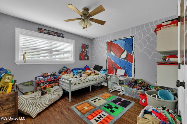 bedroom with ceiling fan and dark hardwood / wood-style flooring