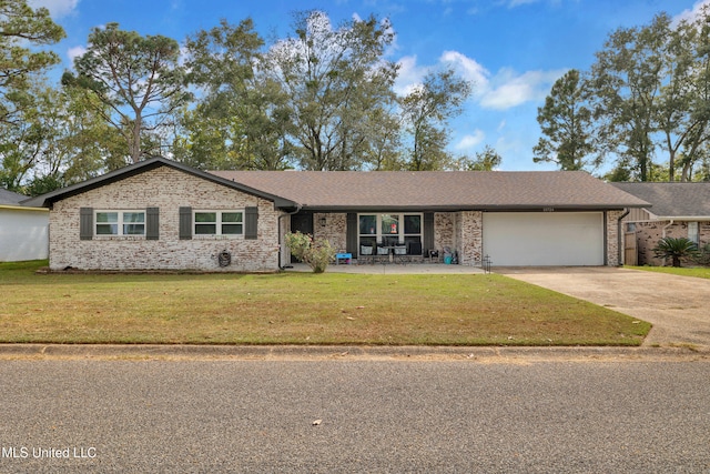 ranch-style home with a front lawn and a garage