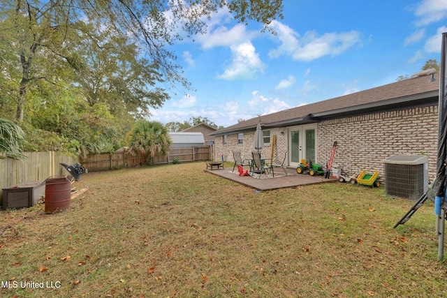 view of yard with a patio area and cooling unit