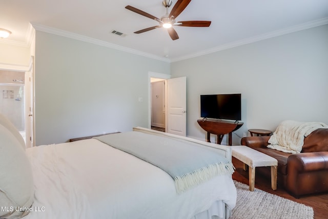 bedroom featuring wood finished floors, visible vents, a ceiling fan, and ornamental molding