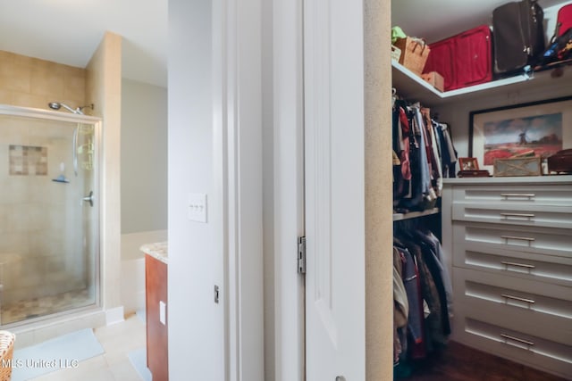 spacious closet featuring tile patterned flooring