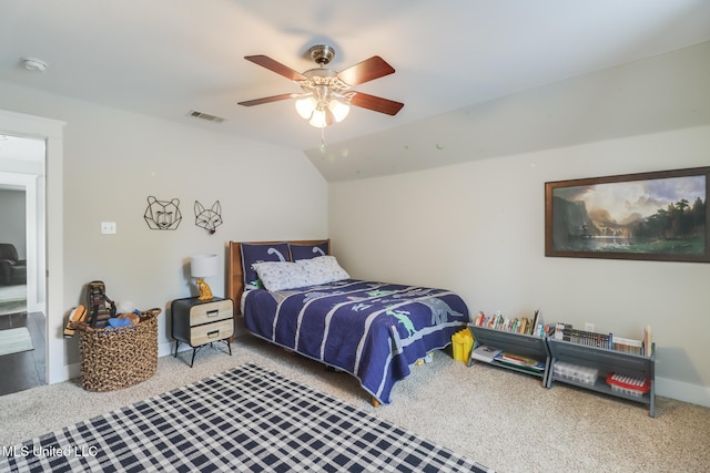 carpeted bedroom with visible vents and ceiling fan