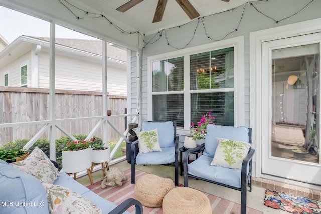 sunroom with ceiling fan