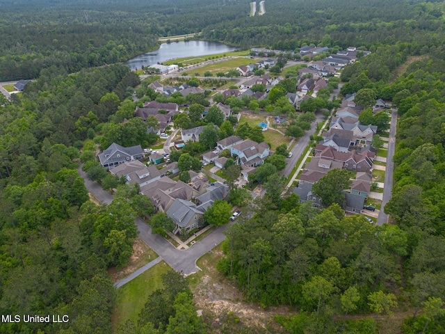 aerial view featuring a water view, a forest view, and a residential view