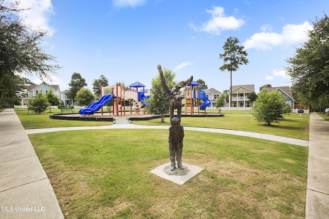 communal playground featuring a yard