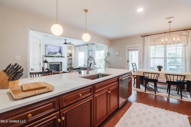 kitchen featuring a wealth of natural light, visible vents, stainless steel dishwasher, and a sink
