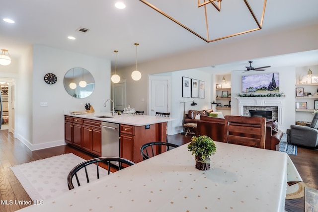 dining room featuring recessed lighting, ceiling fan, a fireplace, dark wood-style floors, and visible vents