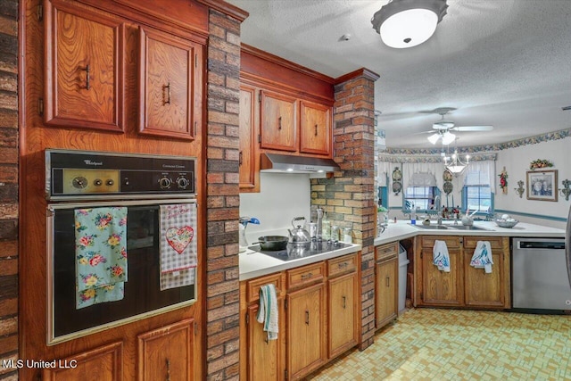 kitchen with ceiling fan, sink, black appliances, and a textured ceiling