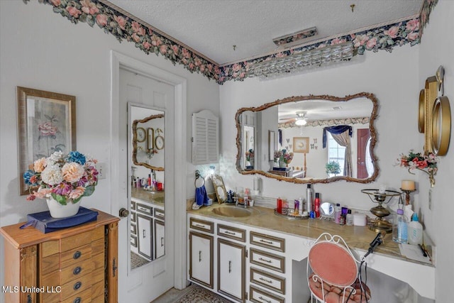 bathroom featuring vanity and a textured ceiling