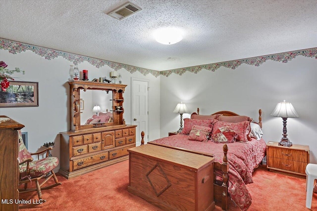 carpeted bedroom featuring a textured ceiling