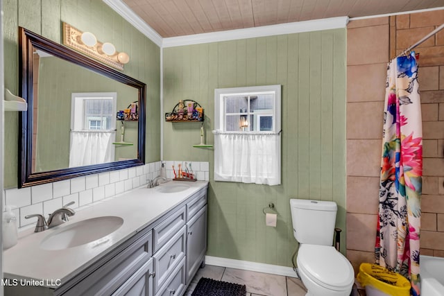 full bath featuring double vanity, toilet, crown molding, and a sink