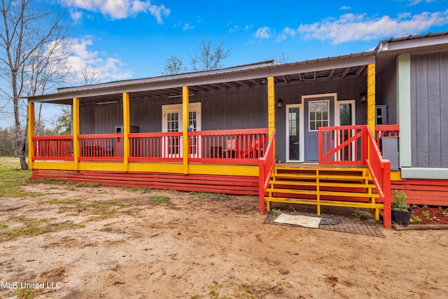 view of front of house featuring a porch and metal roof