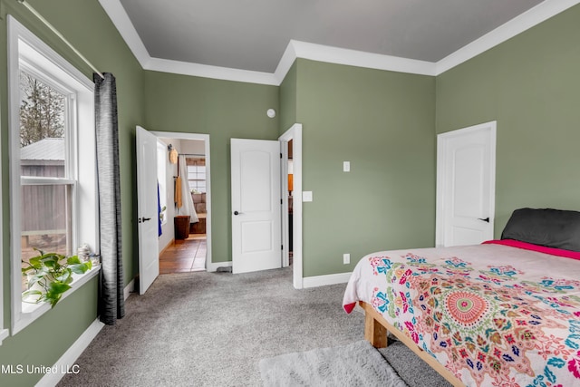 carpeted bedroom with multiple windows, baseboards, and ornamental molding