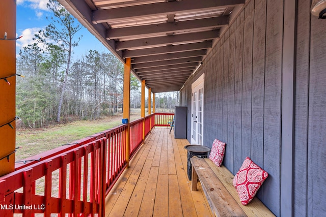 wooden terrace featuring french doors