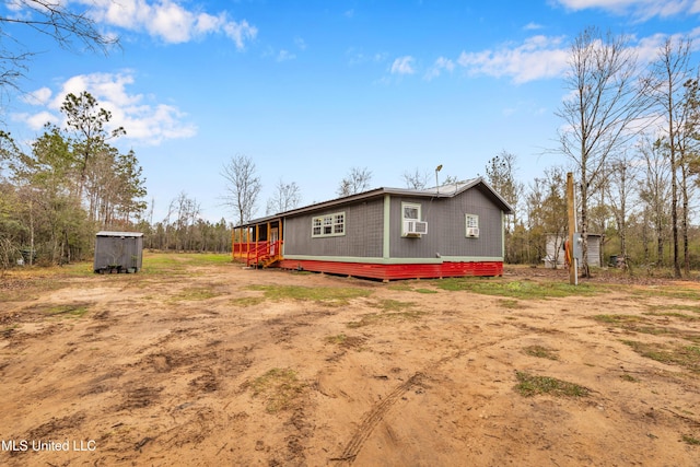 view of side of home featuring cooling unit